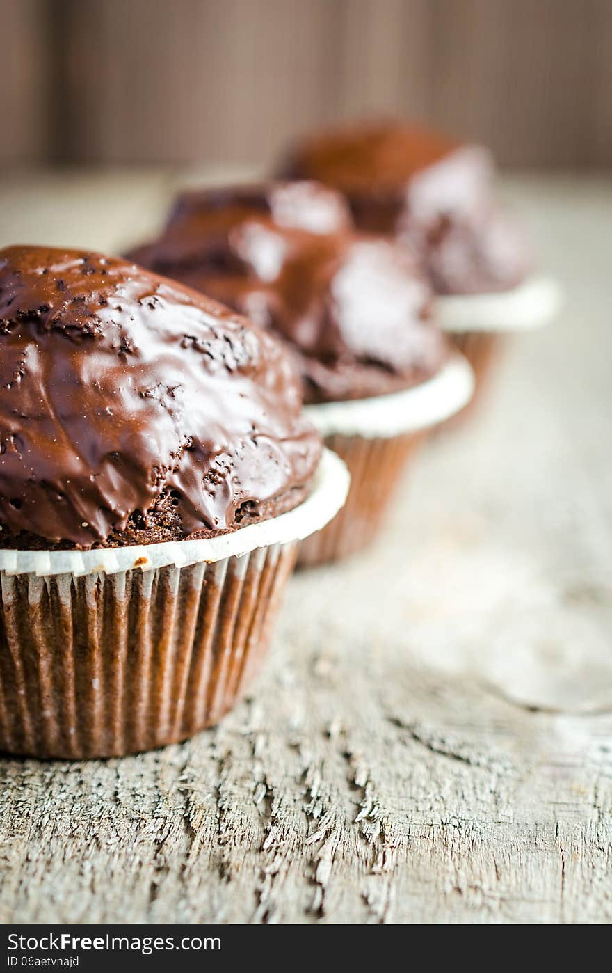 Row of three chocolate muffins