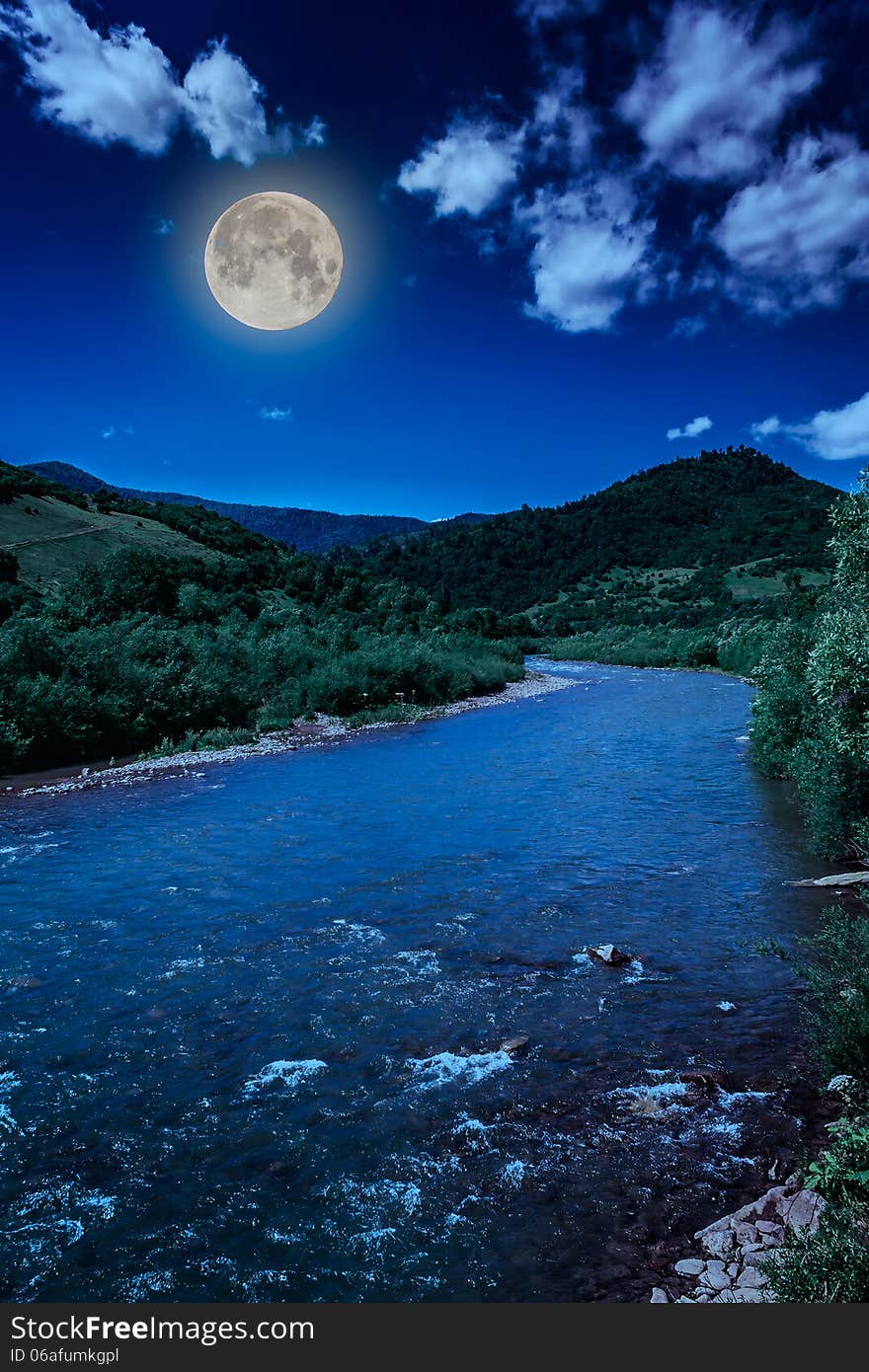 Wild mountain river in mountains on a clear summer night. Wild mountain river in mountains on a clear summer night