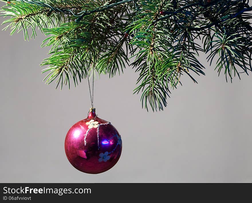 The decoration of Christmas trees. On Christmas eve, on the branches of a spruce hung toys and garlands.