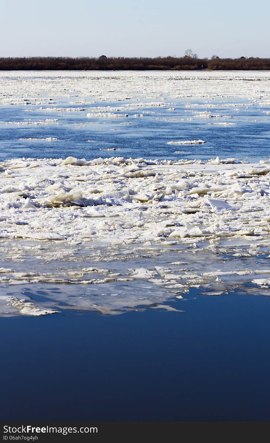 Ice drift on the river the late fall in the bright sunny day