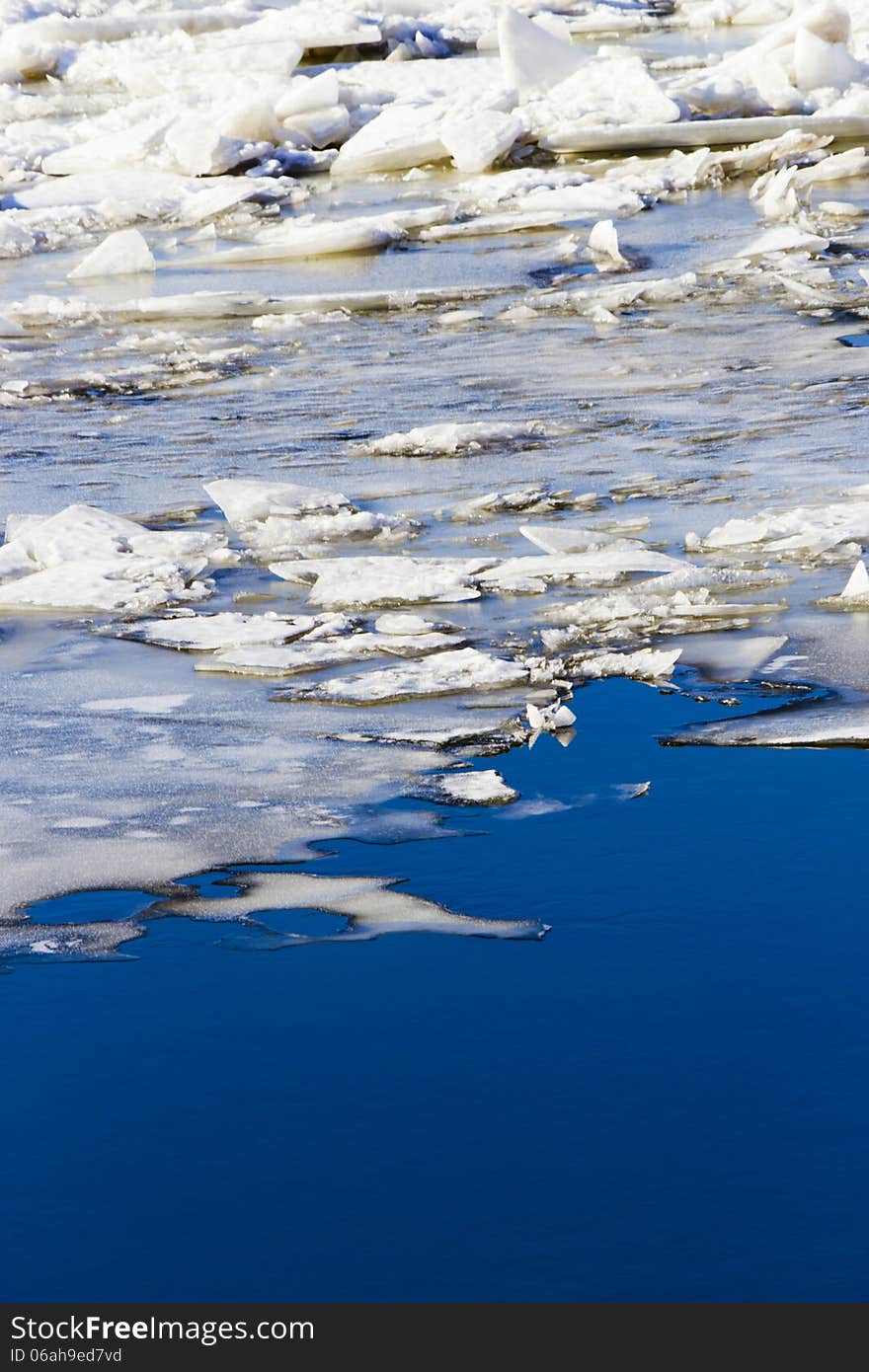 Ice drift on the river the late fall in the bright sunny day