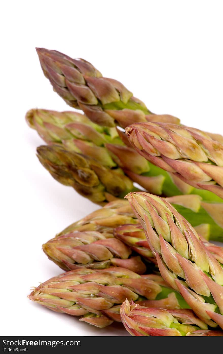 Heap of Perfect Fresh Raw Asparagus Sprouts isolated on white background