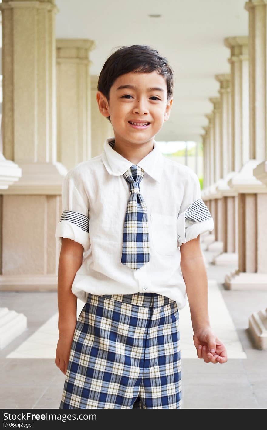 Happy student at school on walkway