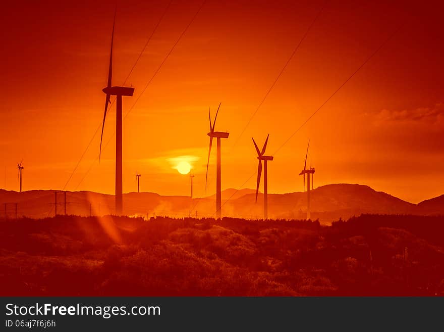 Wind turbines at sunset