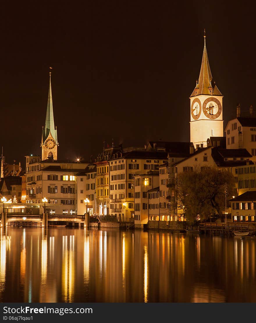 Zurich, Switzerland. The Limmat river, Lady Minster and St. Peter church, autumn evening. Zurich, Switzerland. The Limmat river, Lady Minster and St. Peter church, autumn evening