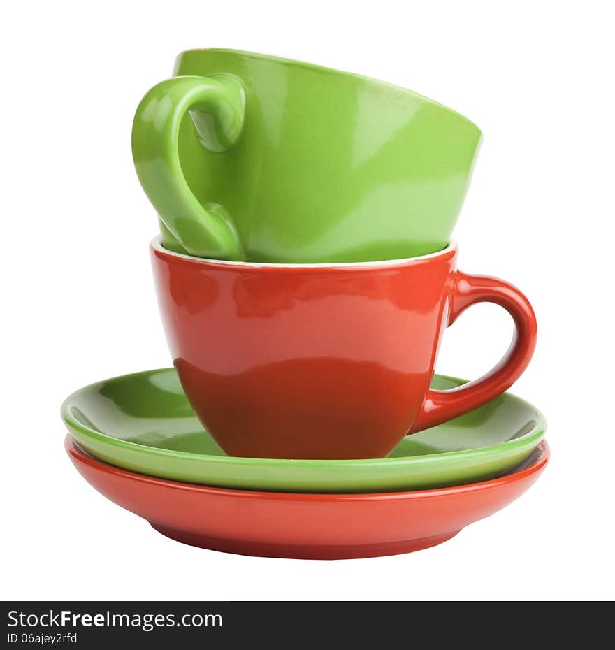 Stack of red and green tea cups and saucers