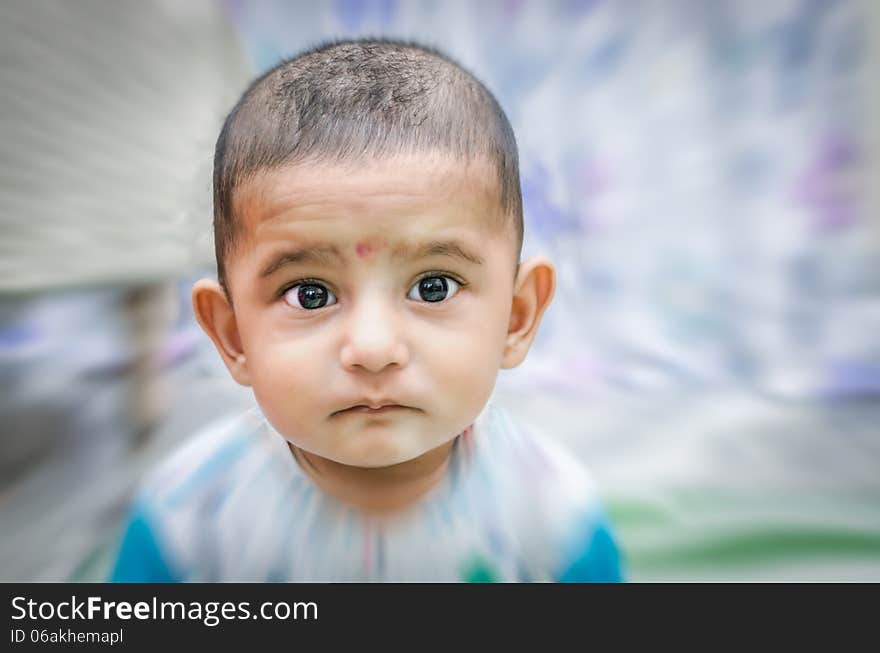 Portrait of cute baby boy looking at camera