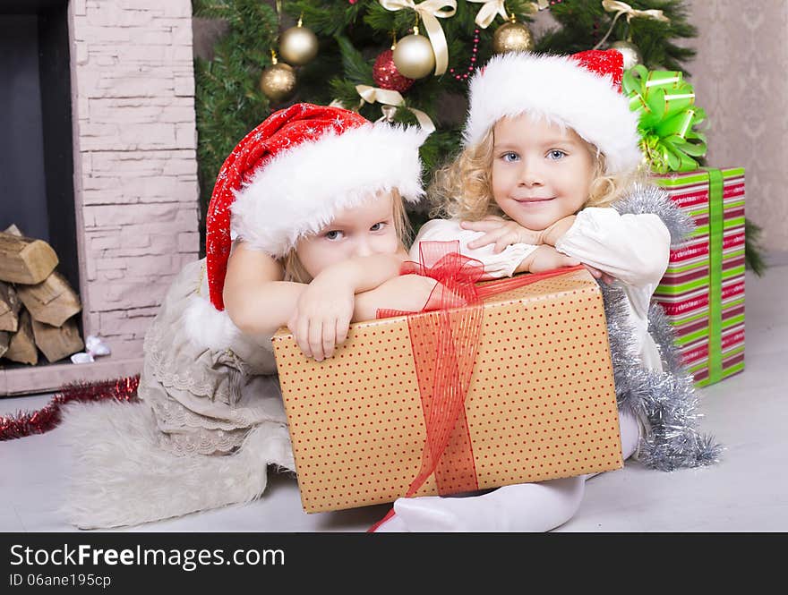 Funny little girls with Christmas gifts. Funny little girls with Christmas gifts