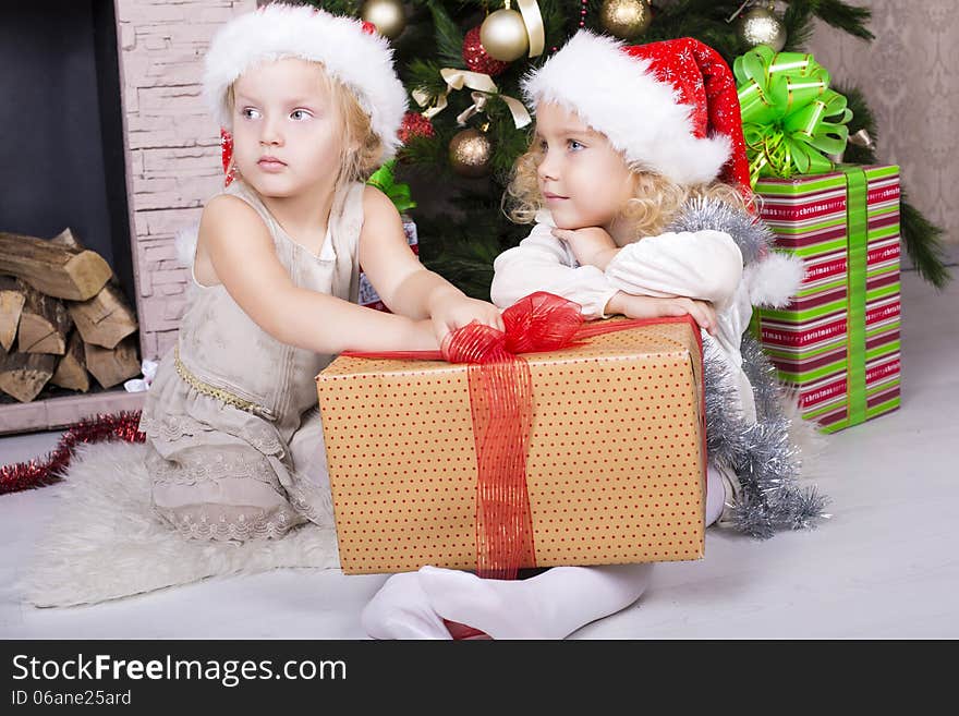 Funny little girls with Christmas gifts. Funny little girls with Christmas gifts