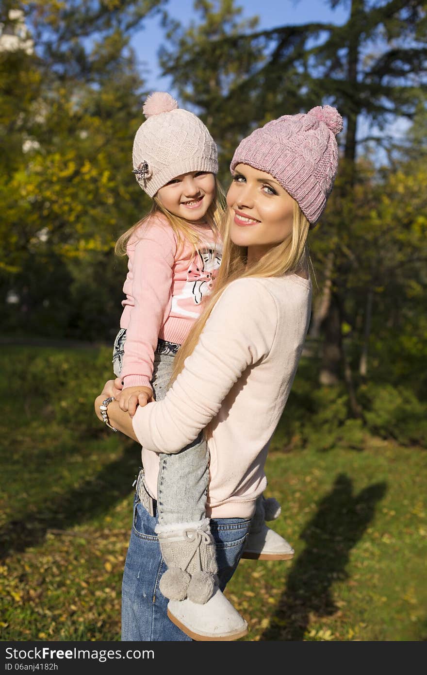 Mother and her little girl having fun in park