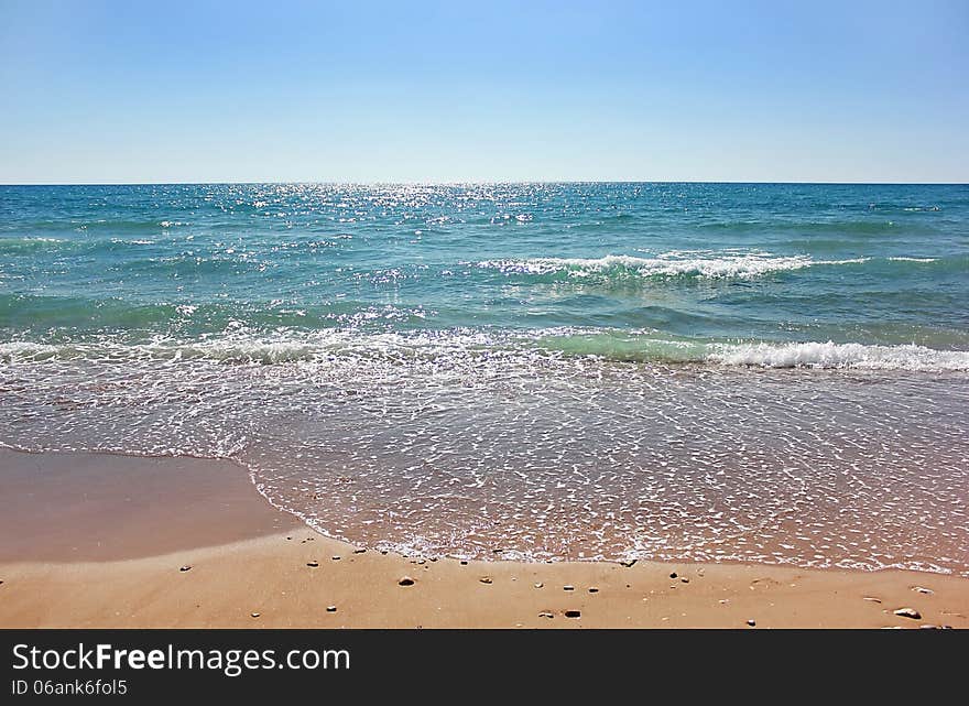 Mediterranean sea, sunny day, and the small waves sparkle in the sun. Mediterranean sea, sunny day, and the small waves sparkle in the sun