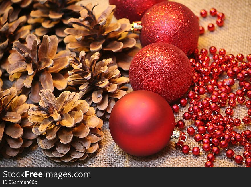 Christmas background - red balls, pine cone