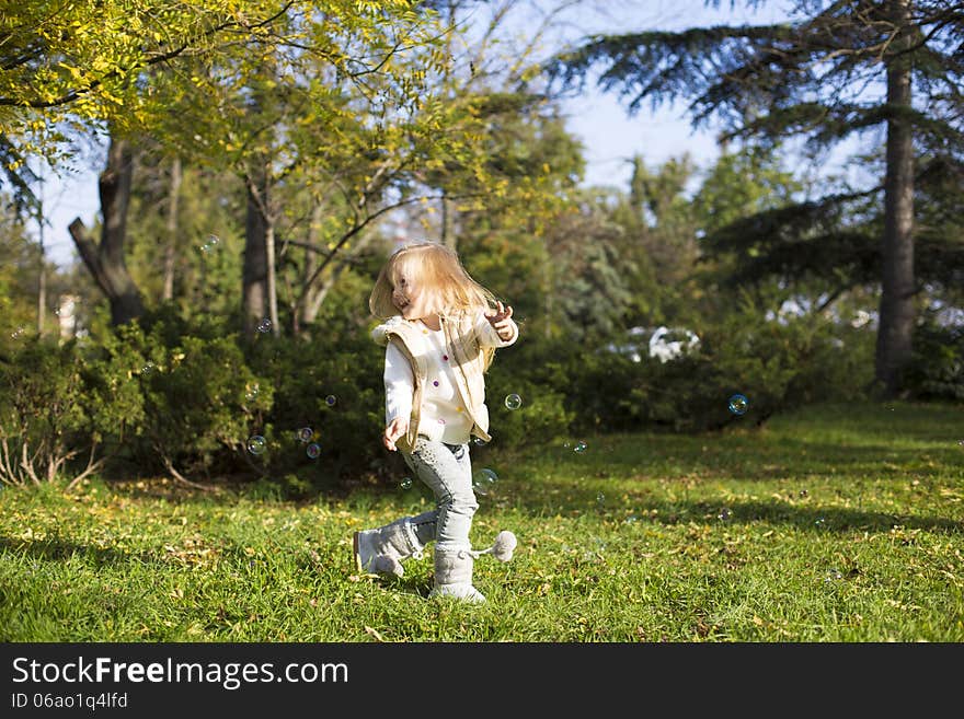 Funny Little Girl With Soap Bubbles