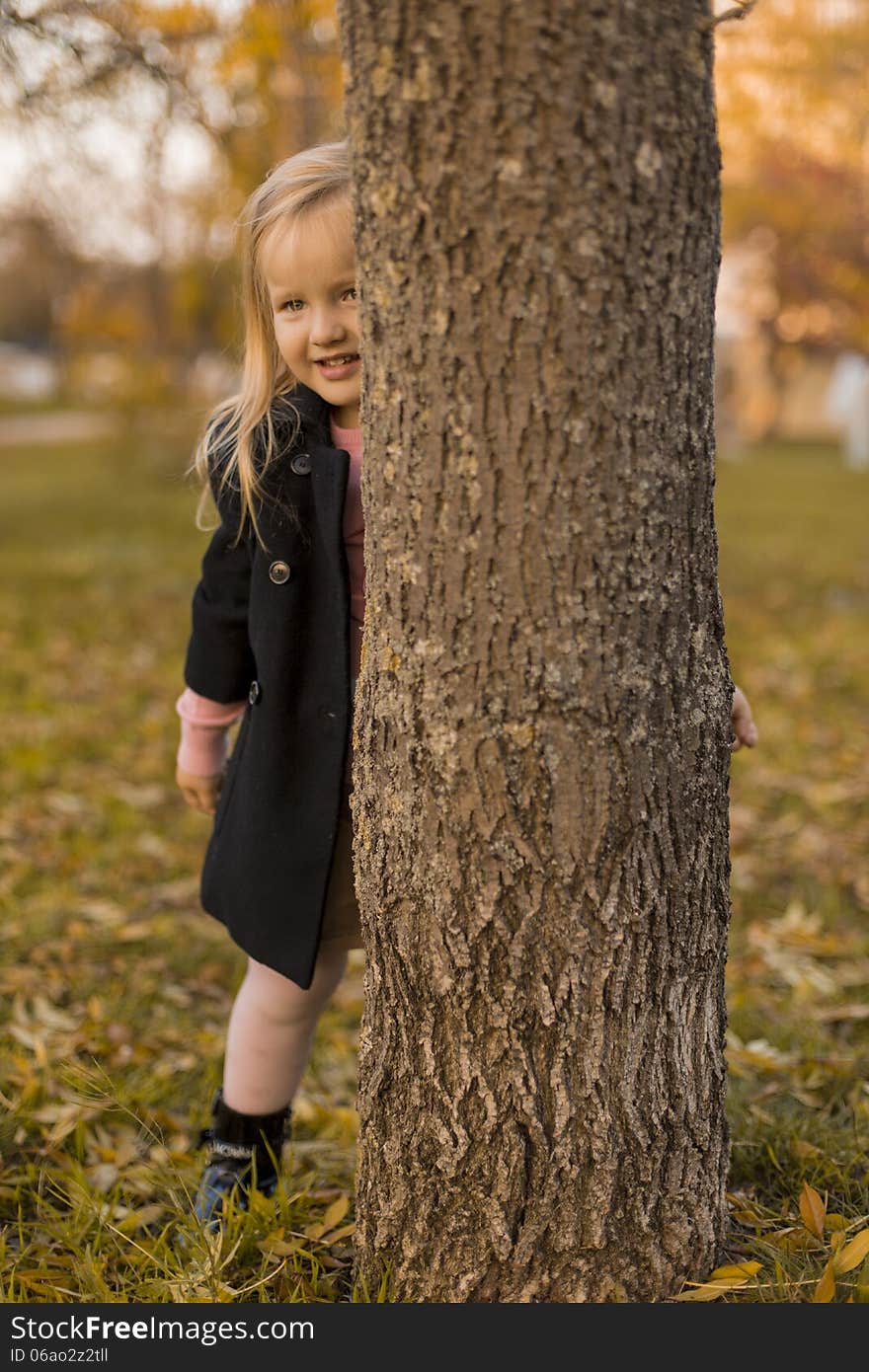 Funny little girl in park. Funny little girl in park