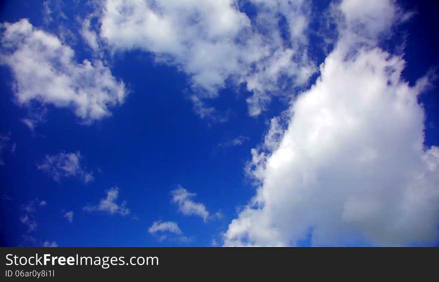 Blue sky with fluffy clouds in 1080p