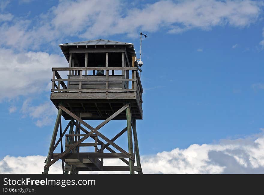 Wooden observation tower at Hutchinson Island, Florida with background of blue skies and clouds. Wooden observation tower at Hutchinson Island, Florida with background of blue skies and clouds.