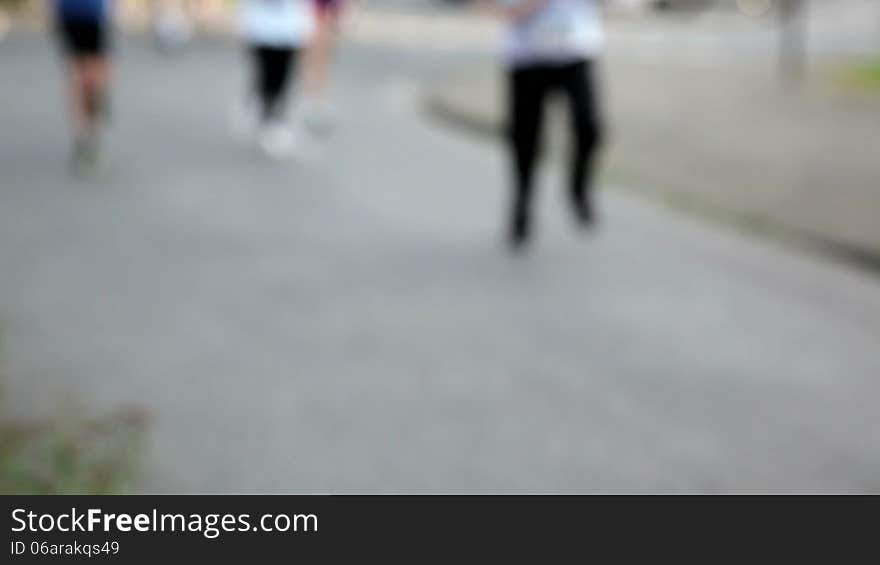 A crowd of athletes running a race. woman, men and children. A crowd of athletes running a race. woman, men and children.