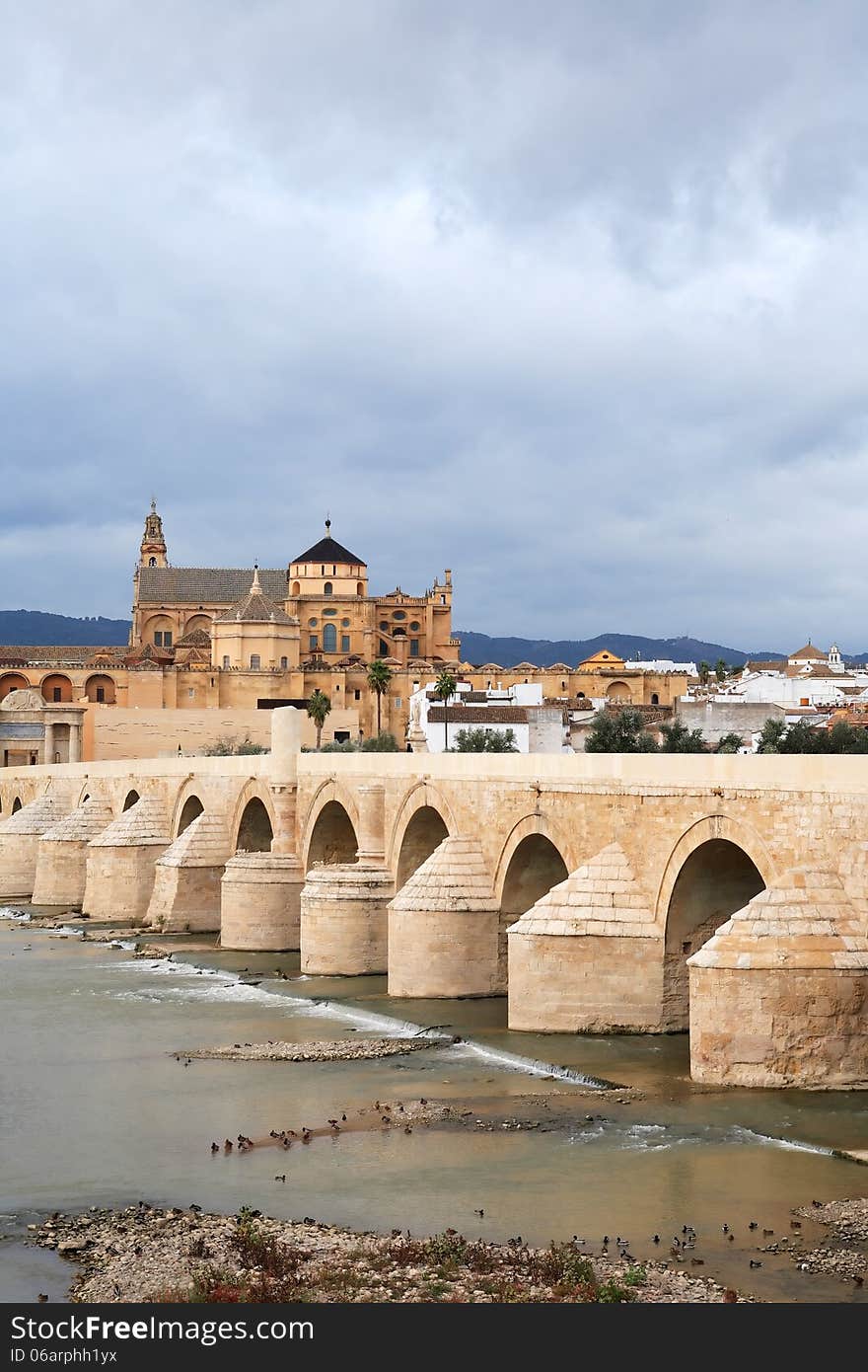 View at ancient Cathedral and bridge across Guadalquivir river in Cordoba, Spain