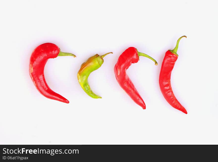 Red hot peppers on white background