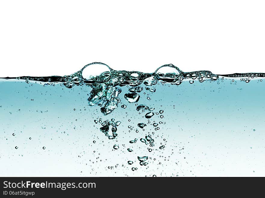 A splash of water,drops and bubbles on a white background. A splash of water,drops and bubbles on a white background