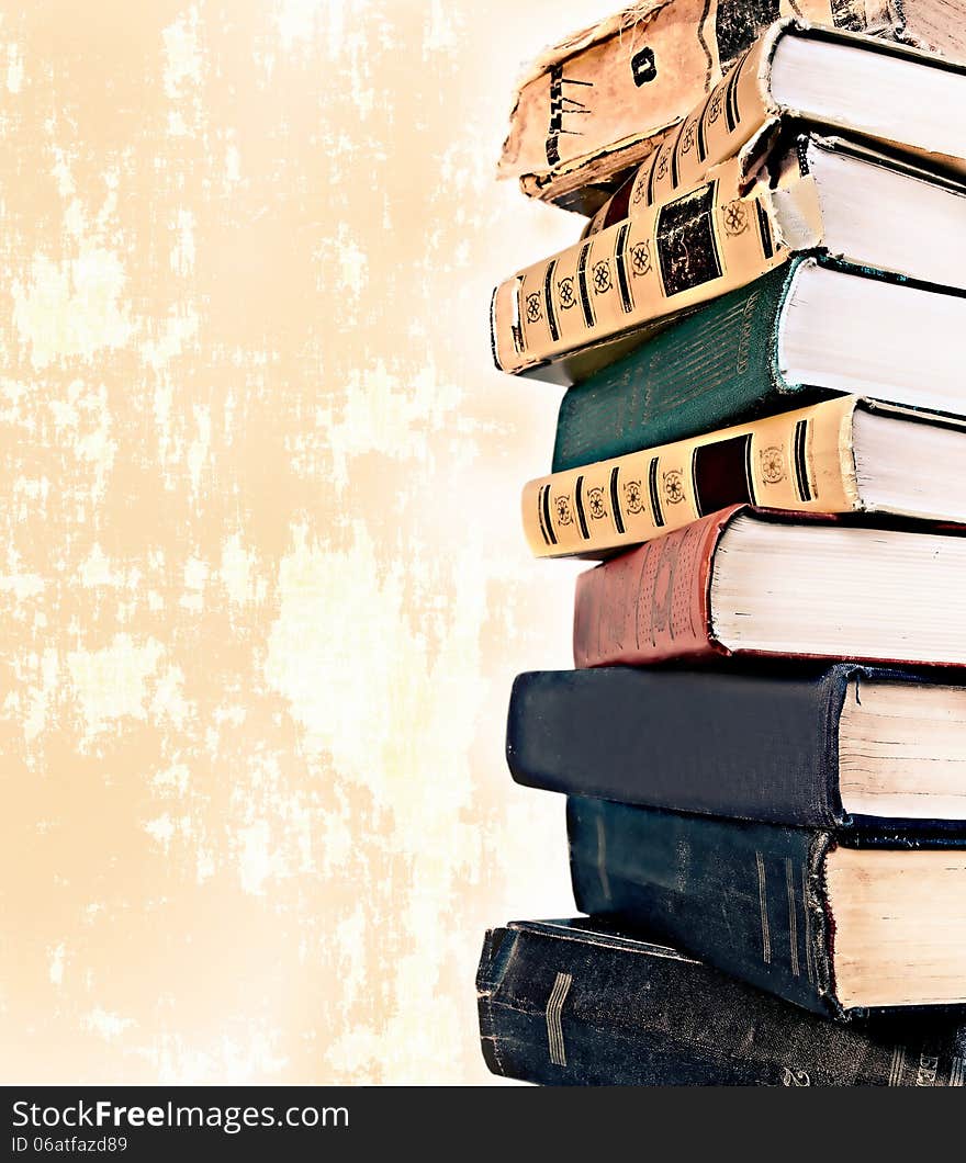 Old style stack of books on grunge background