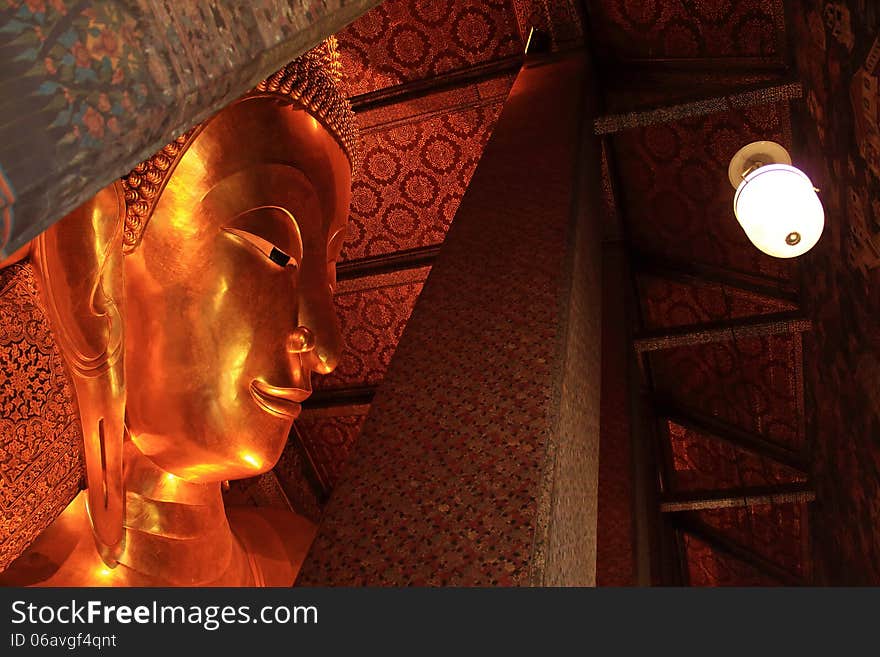 Reclining Buddha gold statue at Wat Pho, Bangkok, Thailand