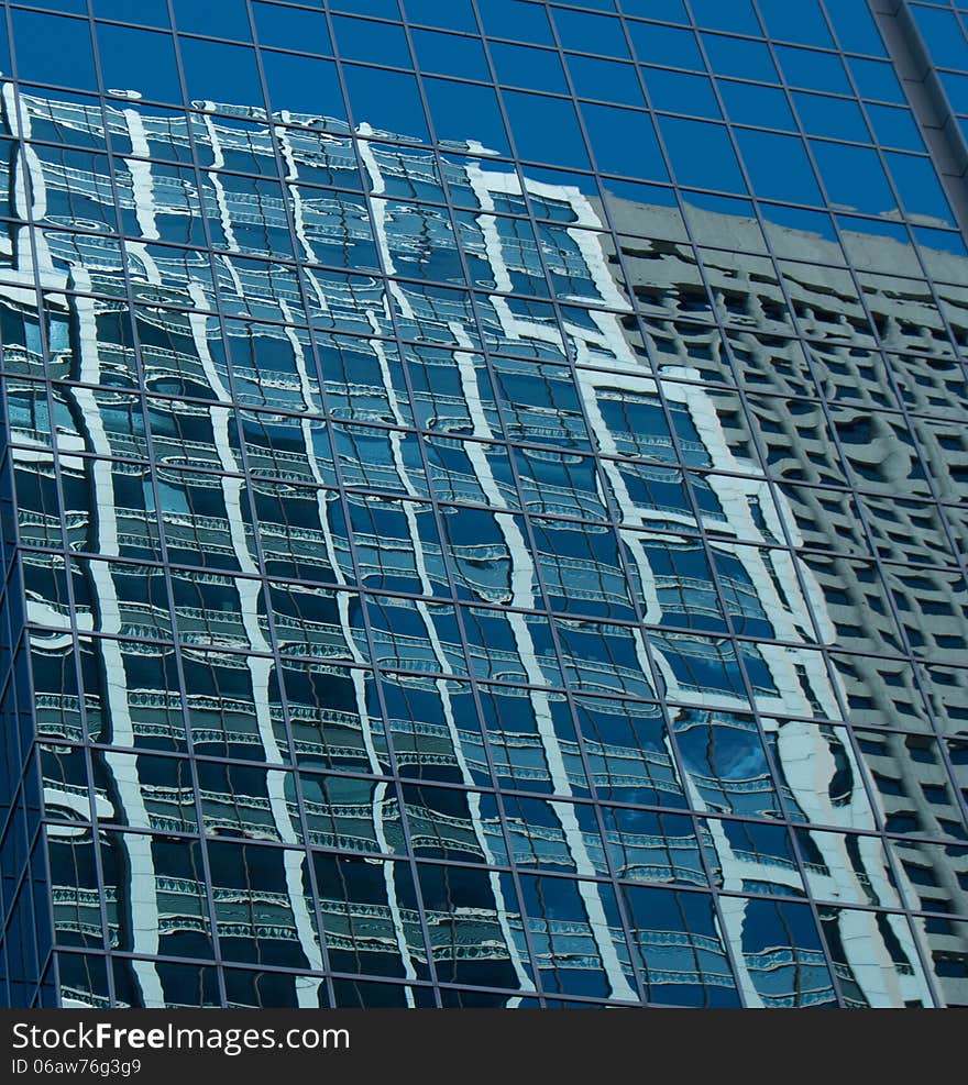 Business buildings reflecting onto glass. Business buildings reflecting onto glass