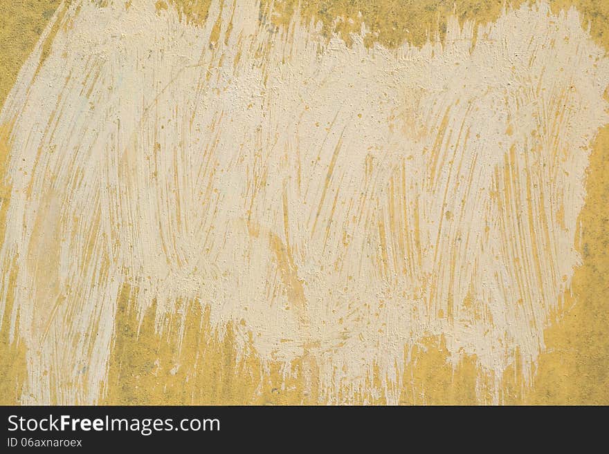 Fragment of yellow grunge painted wall. Fragment of yellow grunge painted wall.