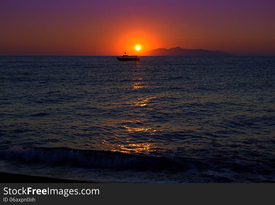 Sunrise.Picture taken at Kamari village beach,Santorini island -one heavenly place. Sunrise.Picture taken at Kamari village beach,Santorini island -one heavenly place.