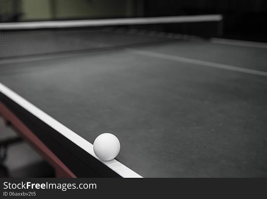 Ping-pong ball on a ping pong table. Ping-pong ball on a ping pong table