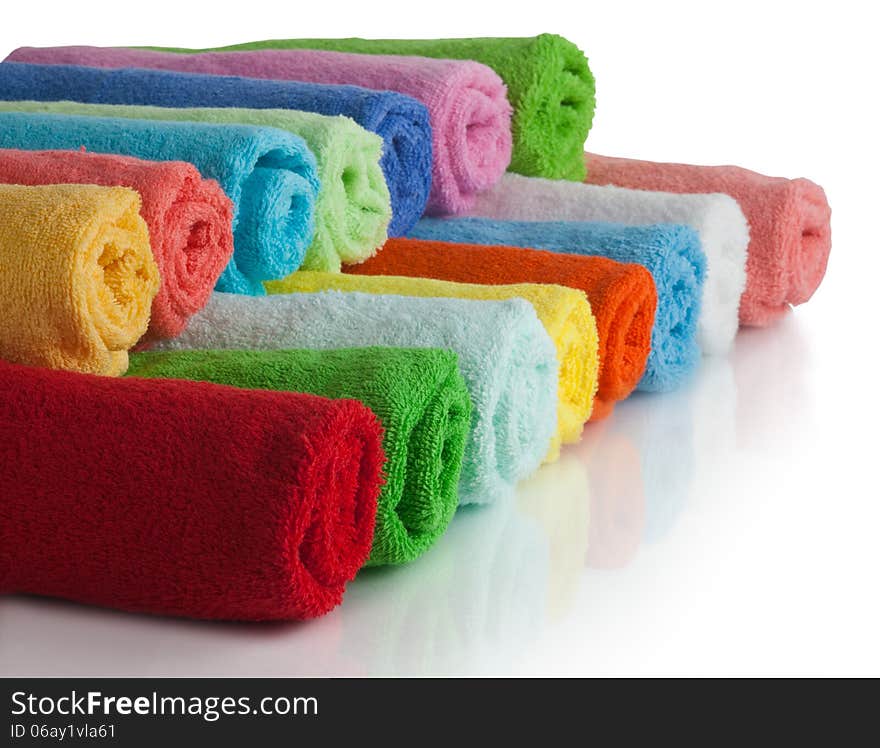 Set of colored towels on white background. Set of colored towels on white background.