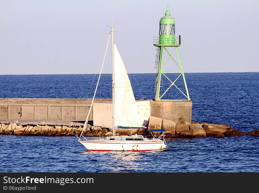 Sailing boat entering in the port of Alicante