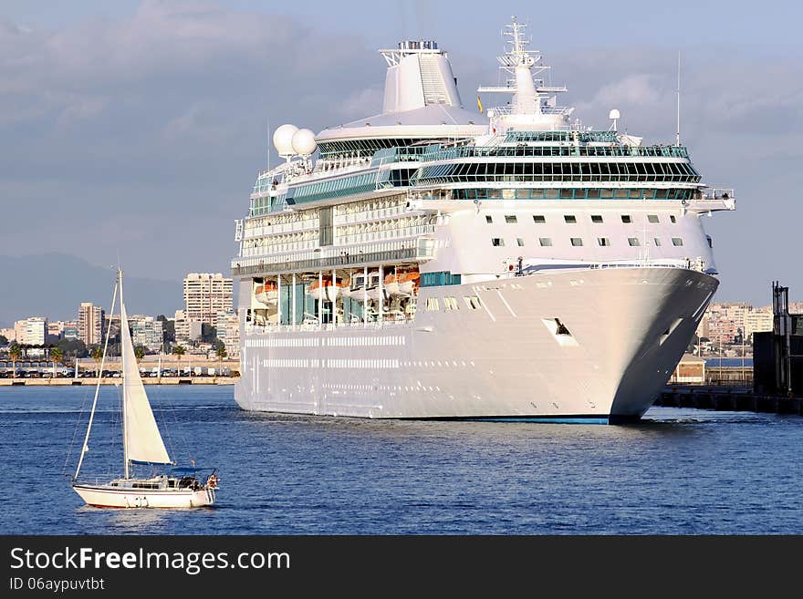 Modern cruise and sailing boat in Alicante harbor