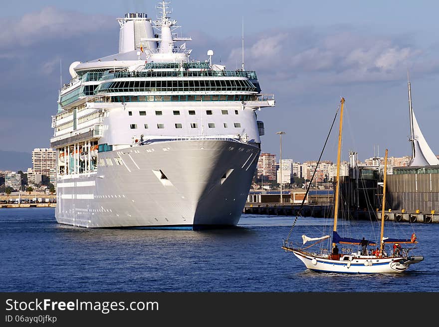 Modern cruise and sailing boat in Alicante harbor