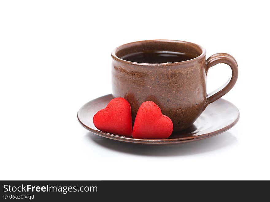 Coffee and candy in the the shape of heart for Valentine's Day, isolated on white. Coffee and candy in the the shape of heart for Valentine's Day, isolated on white