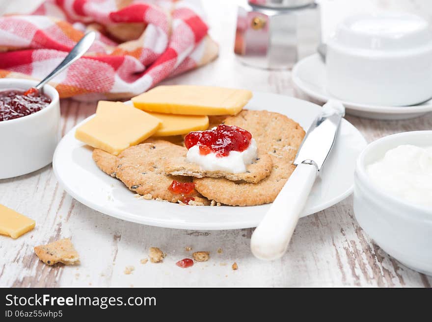 Delicious Breakfast With Crackers, Cream Cheese And Berry Jam