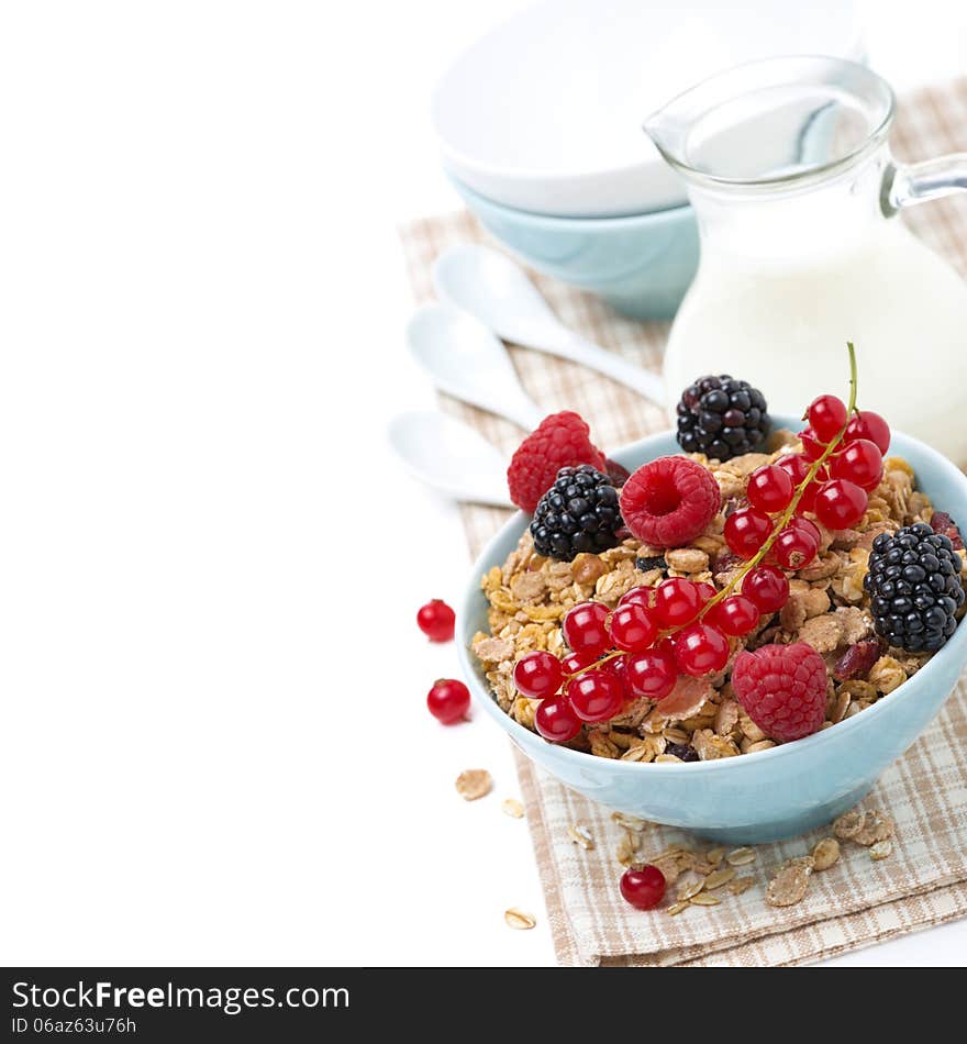 Delicious homemade granola with fresh berries and milk, isolated