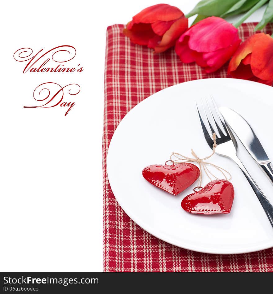 Festive table setting for Valentine's Day with tulips, close-up, isolated on white. Festive table setting for Valentine's Day with tulips, close-up, isolated on white