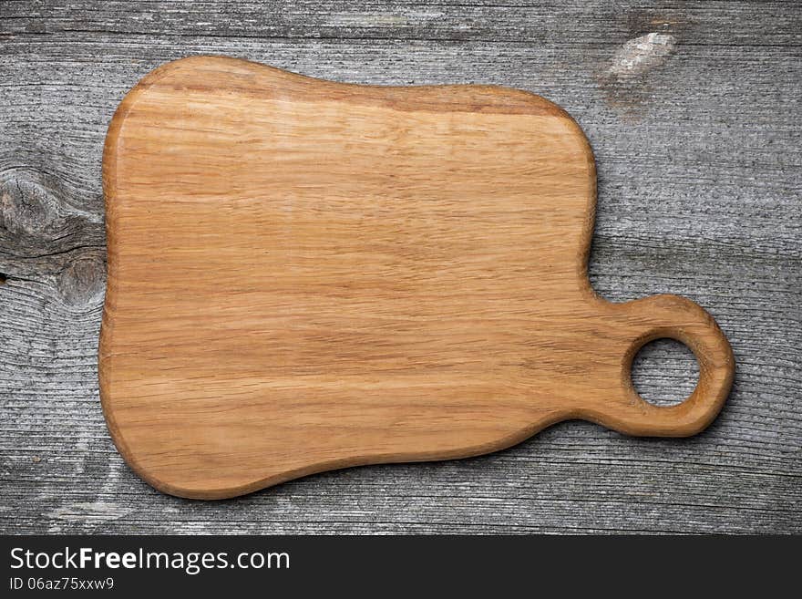 Figured wooden cutting board, concept, a place for the recipe, top view
