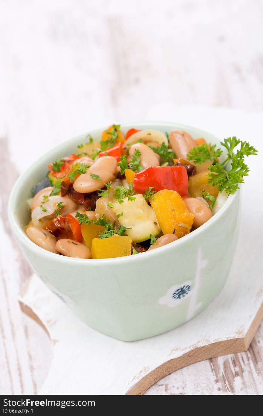 Vegetable stew with beans in a bowl, vertical. Vegetable stew with beans in a bowl, vertical