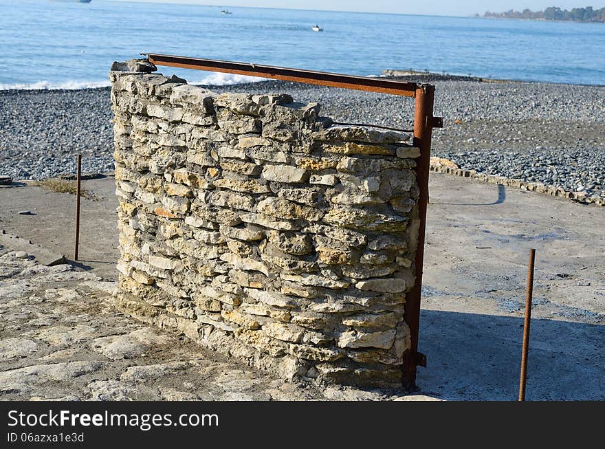 Stone wall on the beach