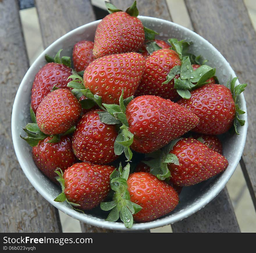 Strawberries in a bowl on a table