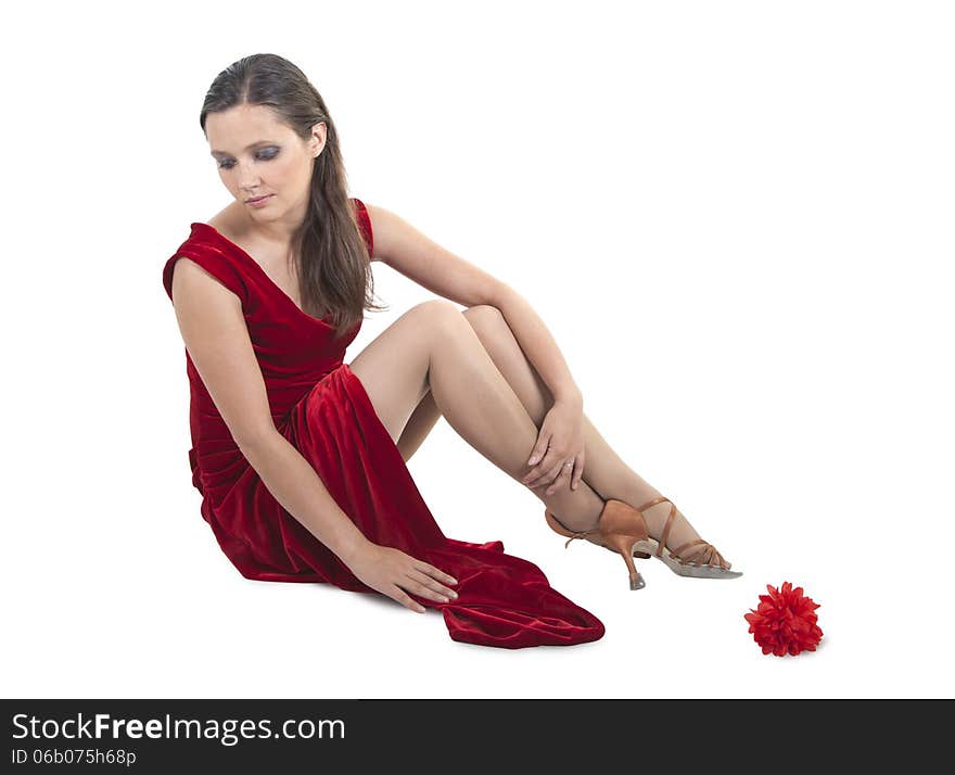 Beautiful woman sitting on the floor, white background