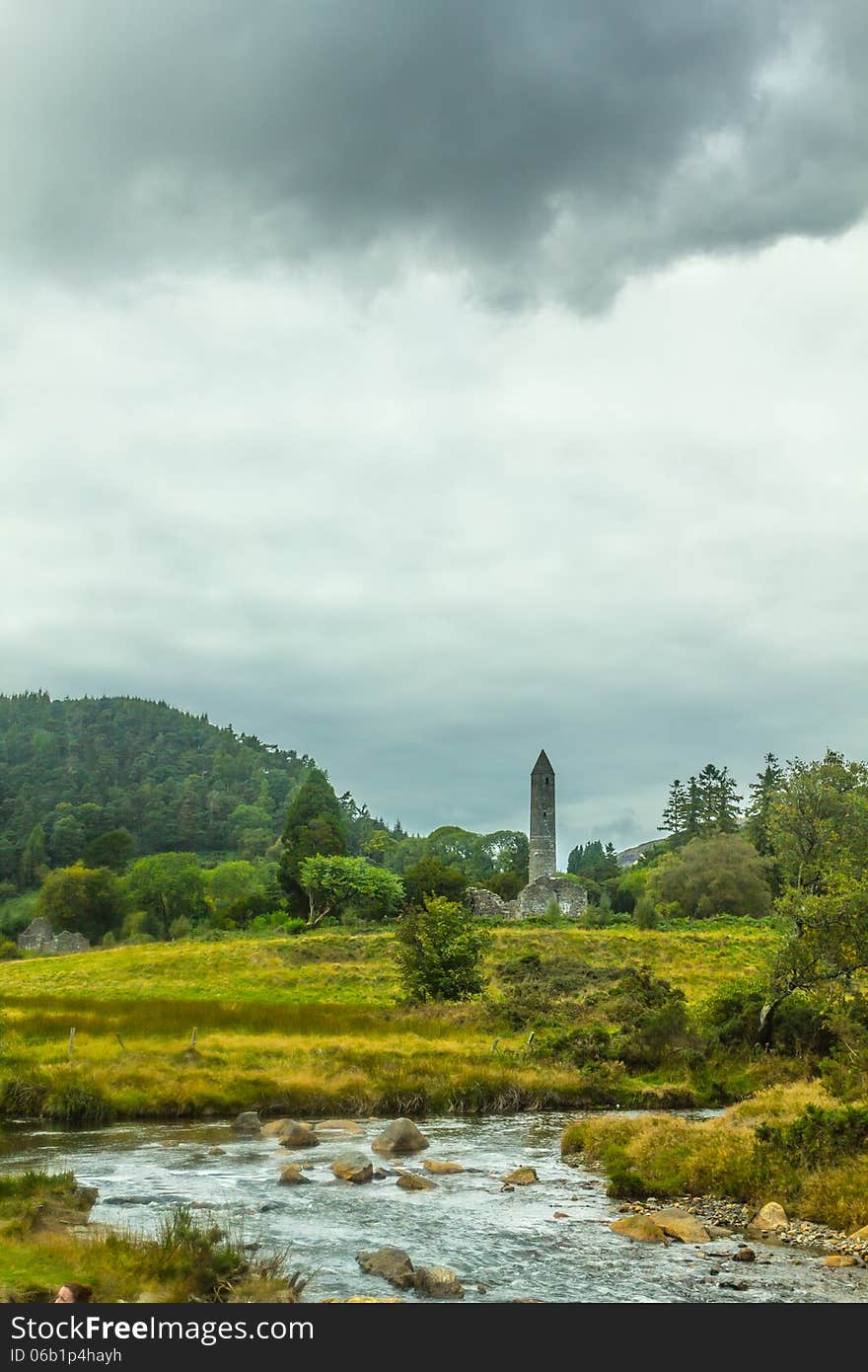 Photo of the Round Tower at Glendalough, Ireland. Taken on a cloudy overcast day. Photo of the Round Tower at Glendalough, Ireland. Taken on a cloudy overcast day