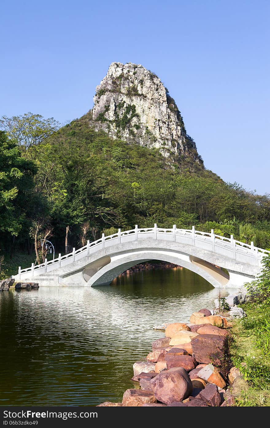 Chinese garden landscape:stone arch bridge and hill. Chinese garden landscape:stone arch bridge and hill