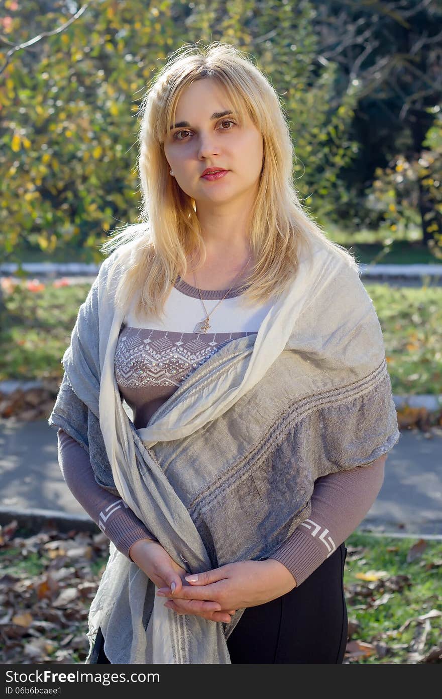 Portrait of a young woman in autumn park