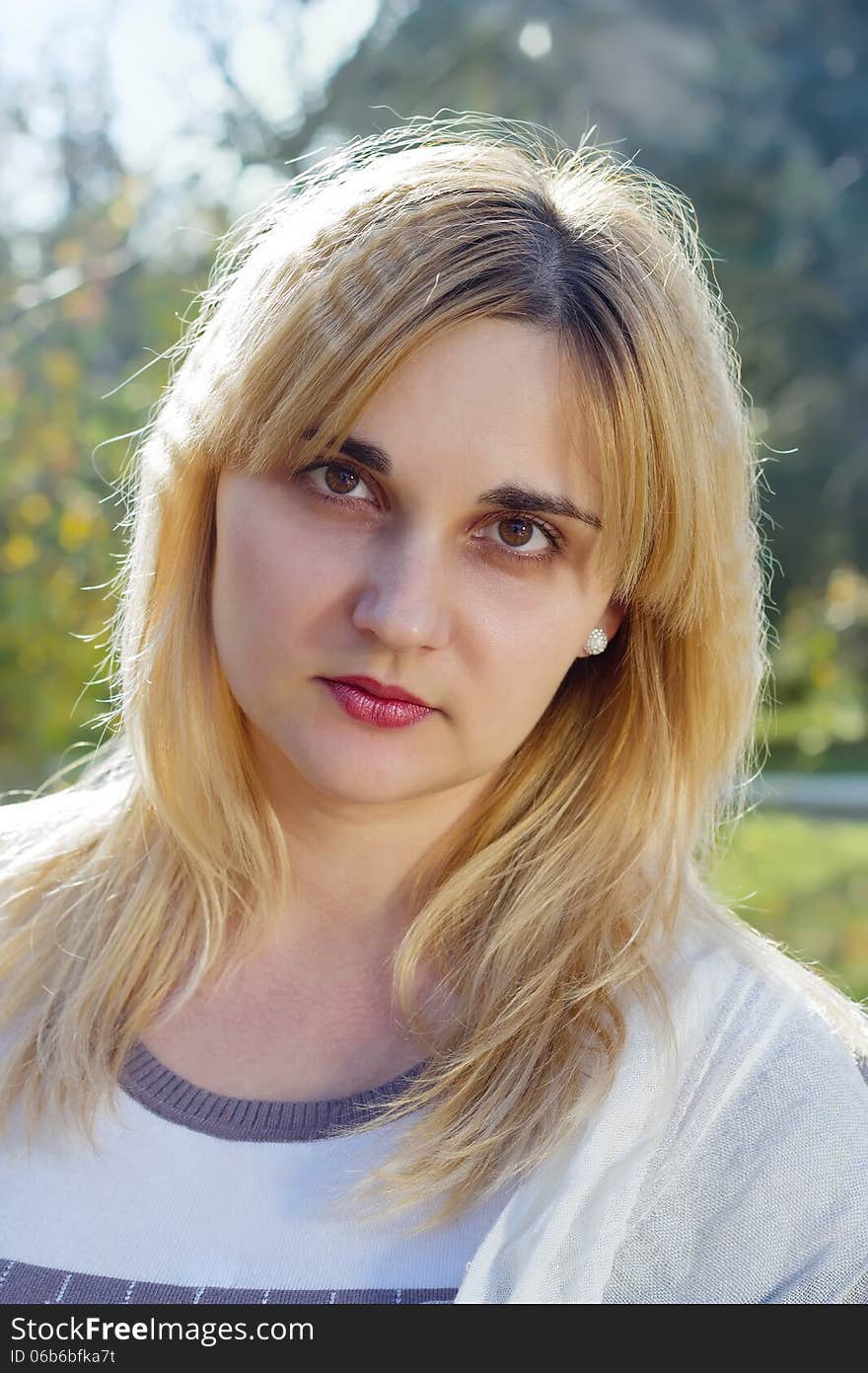 Portrait of a young woman in autumn park