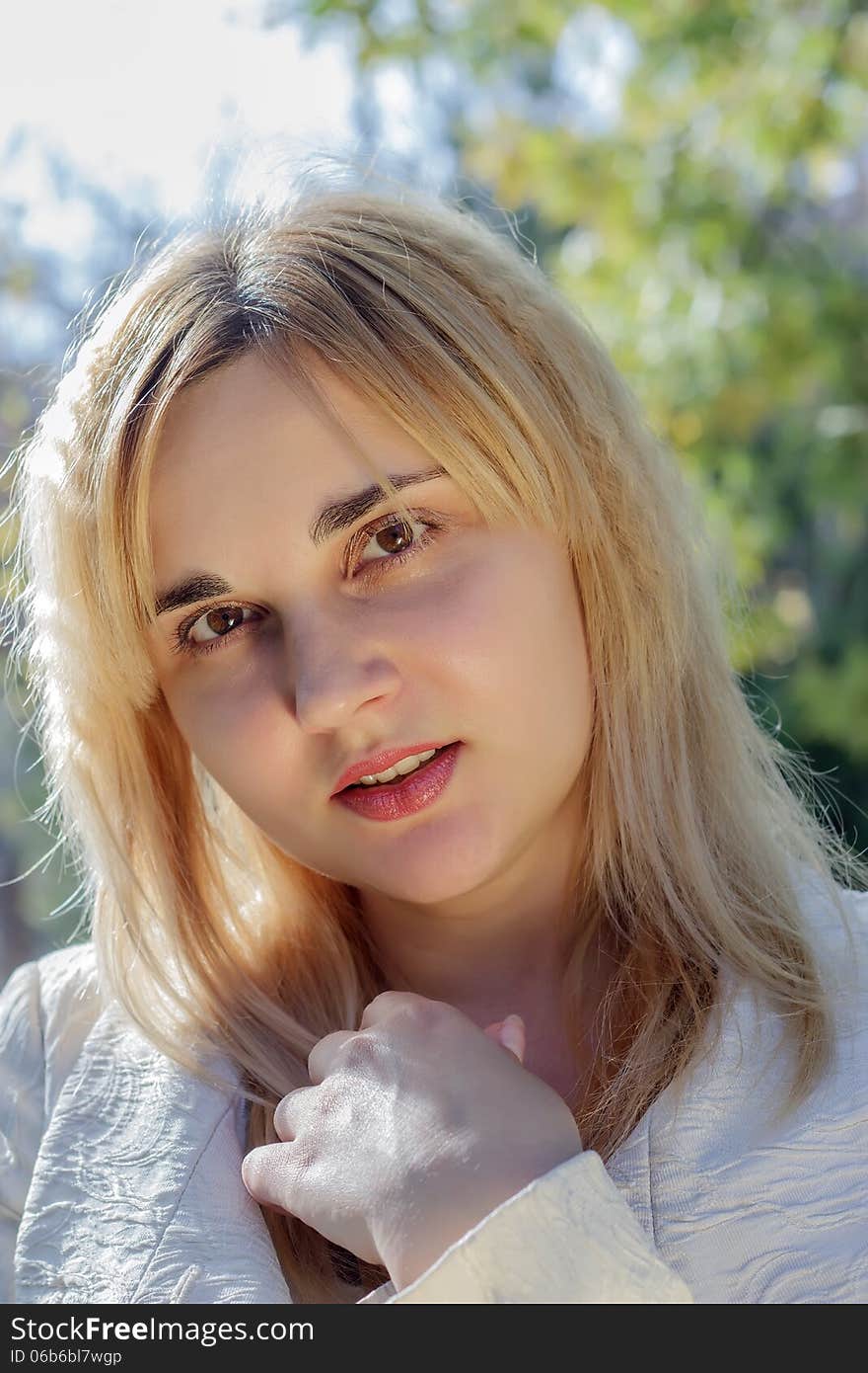 Portrait of a young woman in autumn park