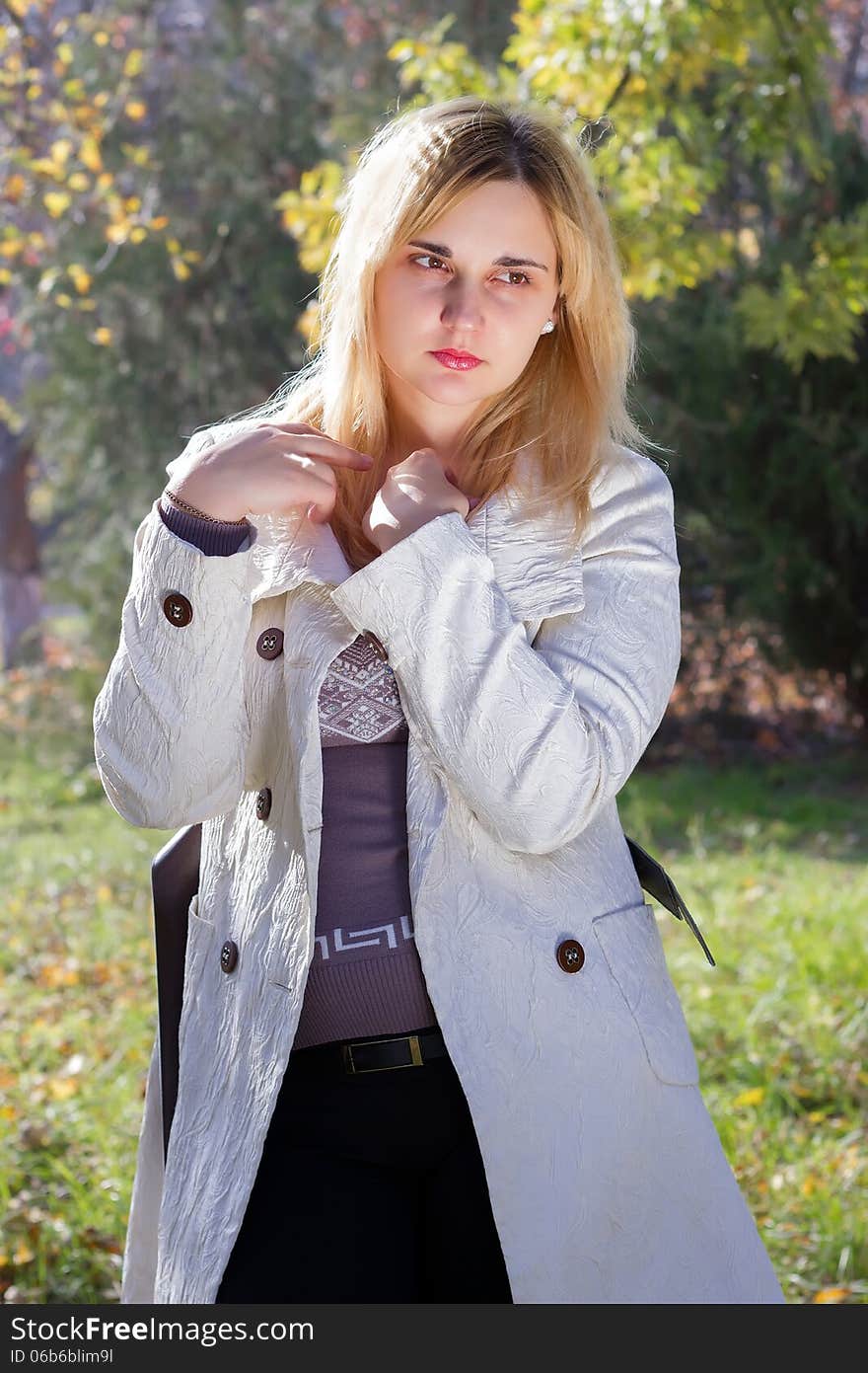 Portrait of a young woman in autumn park