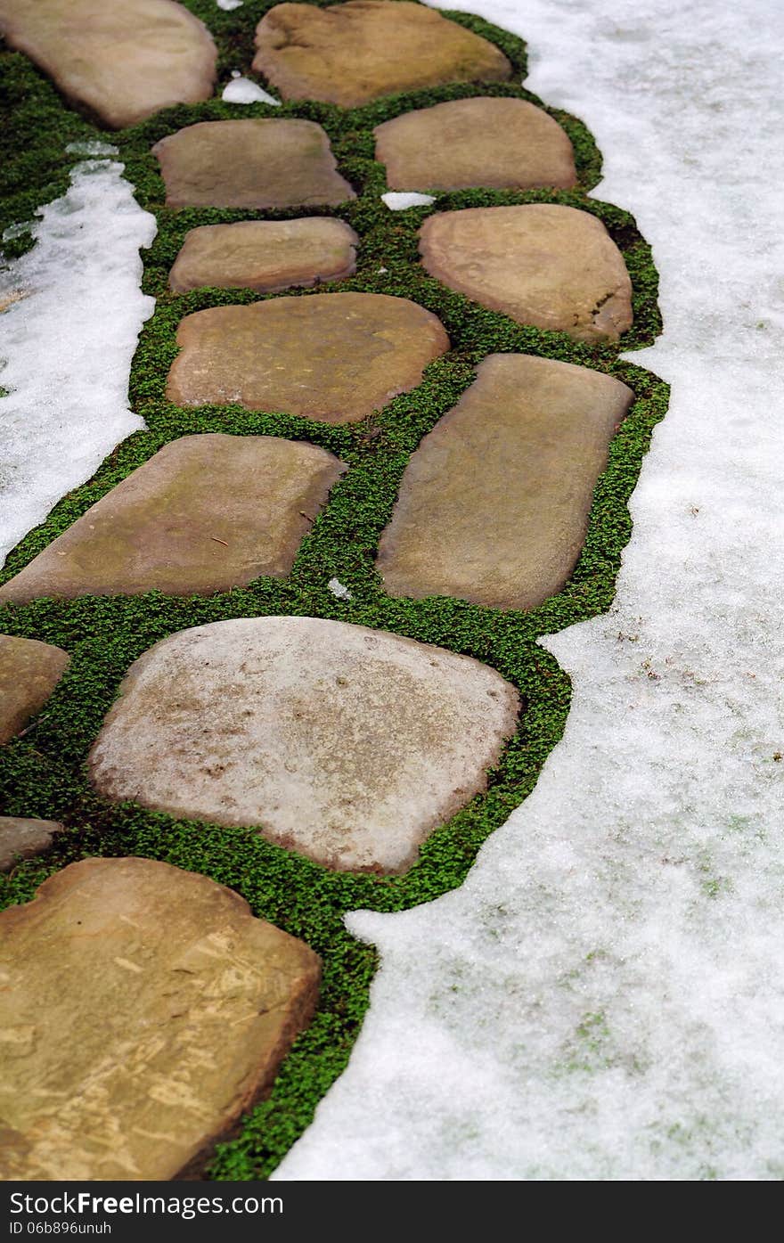 Stone footpath in snow